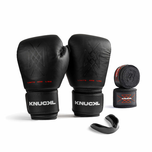 Knuckl Onyx Kit — Includes black boxing gloves, hand wraps, and mouth guard.
