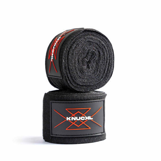 Black 4.5 meter boxing hand wraps rolled with Knuckl branding