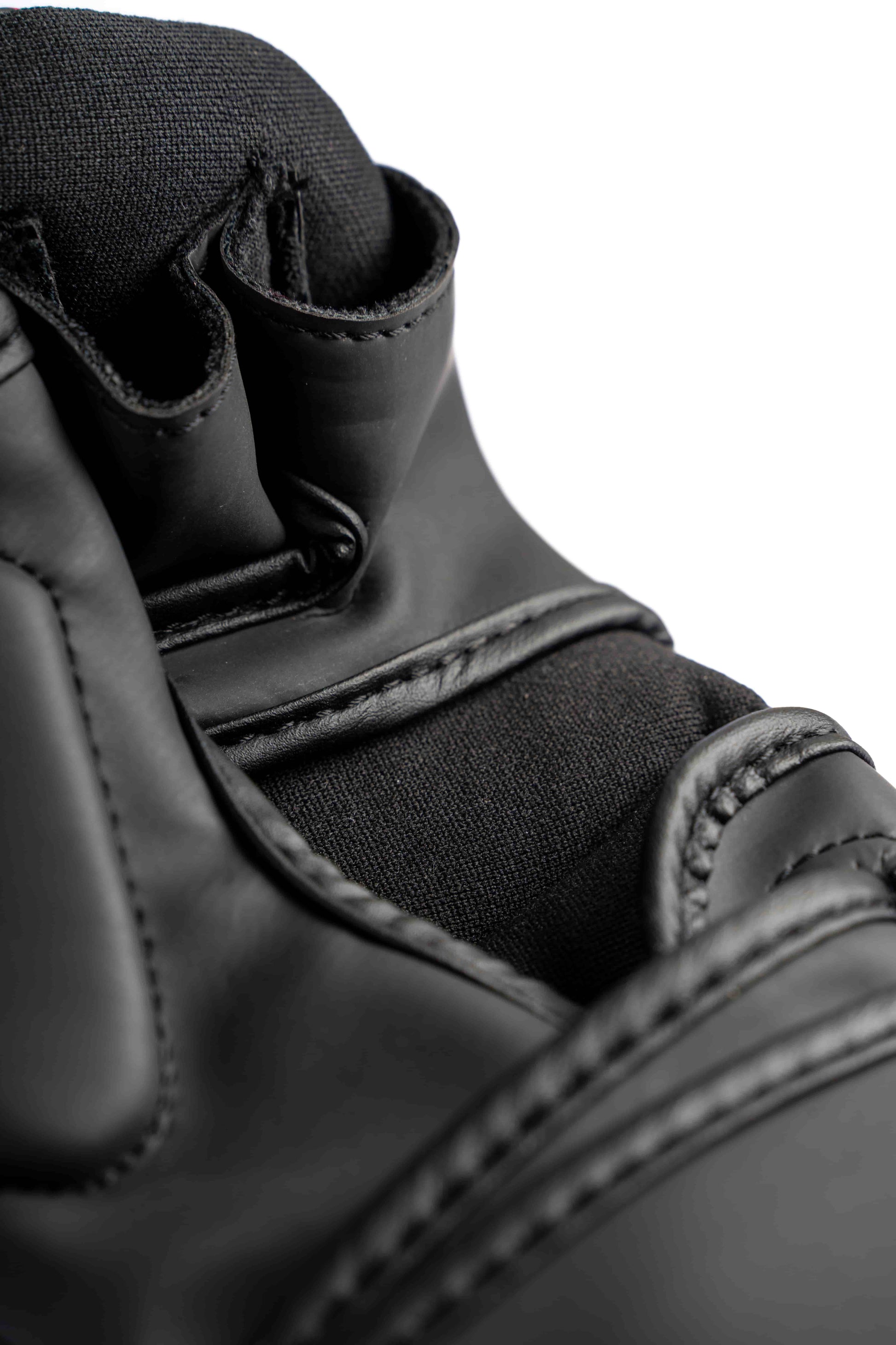 Inside padding and stitching detail of Knuckl hybrid glove