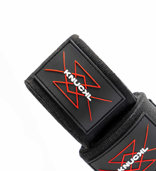 Knuckl hand wrap patch close-up with red crest and branding