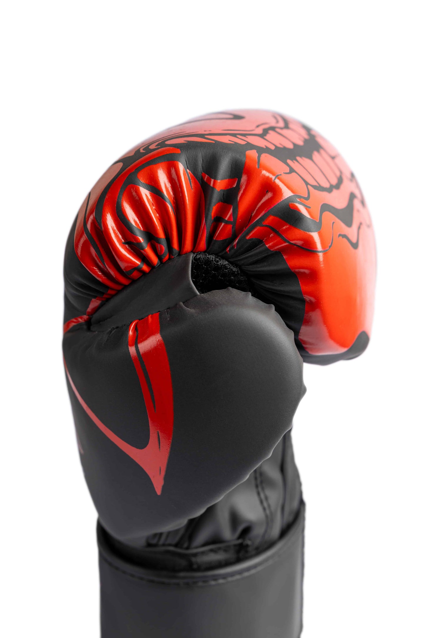 Close-up of red Oni mask graphic on INFERNO boxing glove