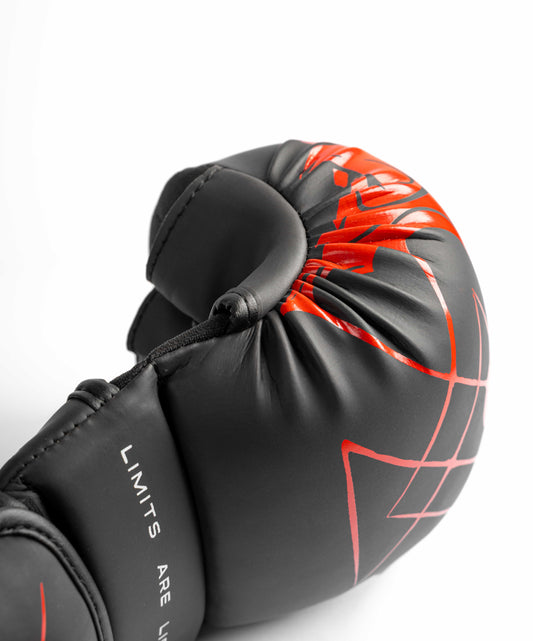 Red knuckle graphic on black hybrid glove close-up
