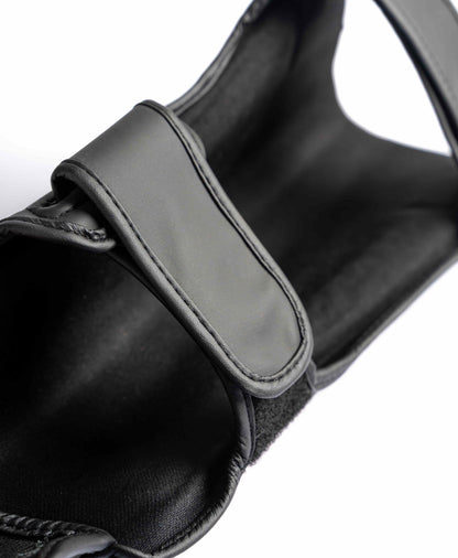 Interior view of Knuckl shin guard showing strap and padding